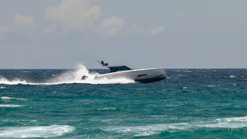 Slide: The Image of 2023 Vanquish Yachts VQ45 speeding on open ocean waters. - 5