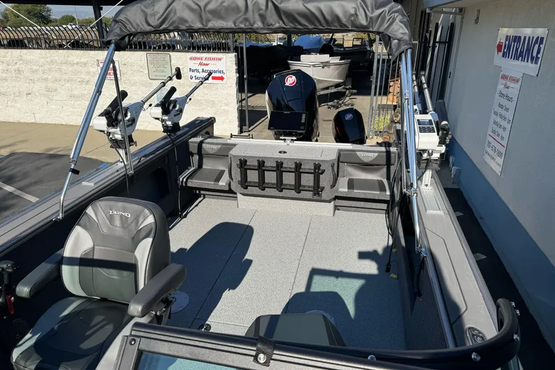 Slide: The Image of 2026 Lund 2075 Fisherman boat interior with seating and fishing equipment. - 10