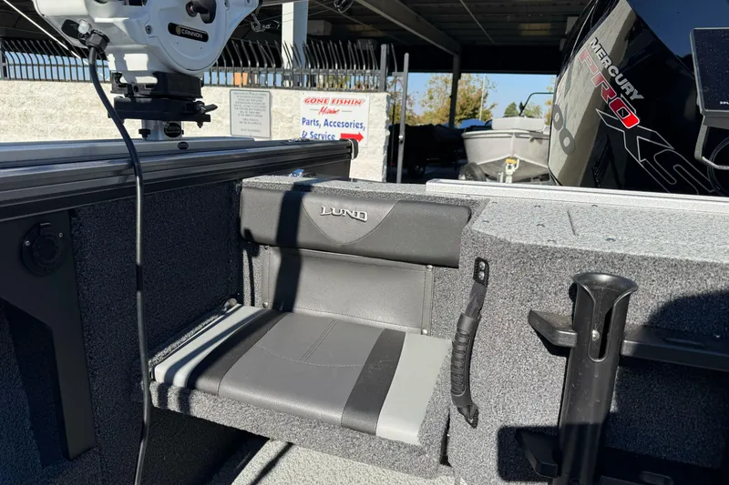 Slide: The Image of 2026 Lund 2075 Fisherman boat interior with seating and Mercury Pro XS engine. - 15