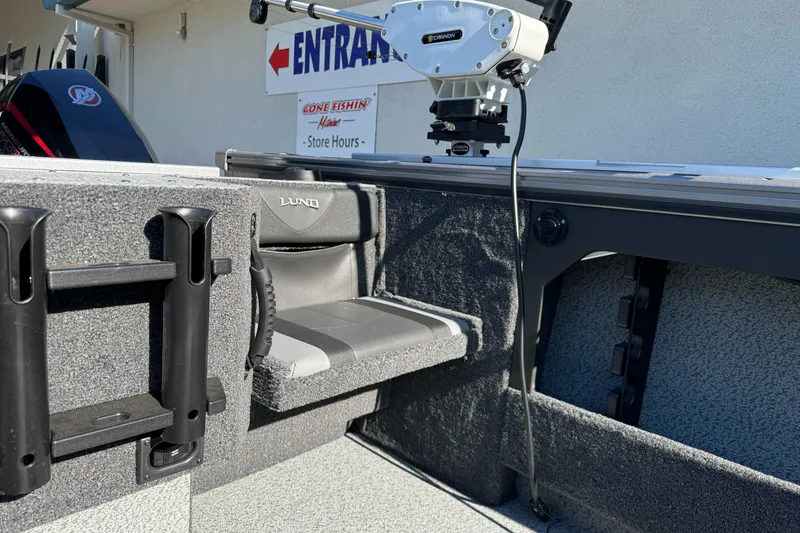 Slide: The Image of 2026 Lund 2075 Fisherman boat interior with seating and fishing equipment. - 16