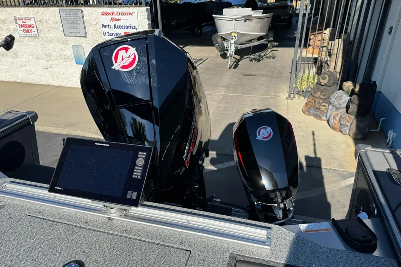 Slide: The Image of 2026 Lund 2075 Fisherman boat with dual outboard motors and navigation system. - 17