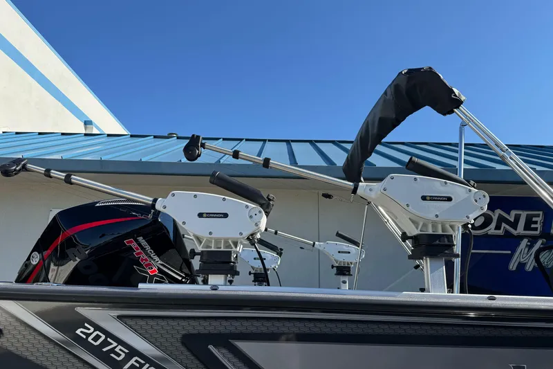 Slide: The Image of 2026 Lund 2075 Fisherman boat with Cannon downriggers and Mercury Pro motor. - 5