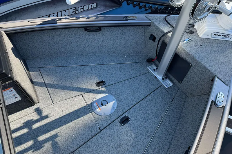Slide: The Image of 2026 Lund 2075 Fisherman boat interior with Minn Kota motor and textured flooring. - 9