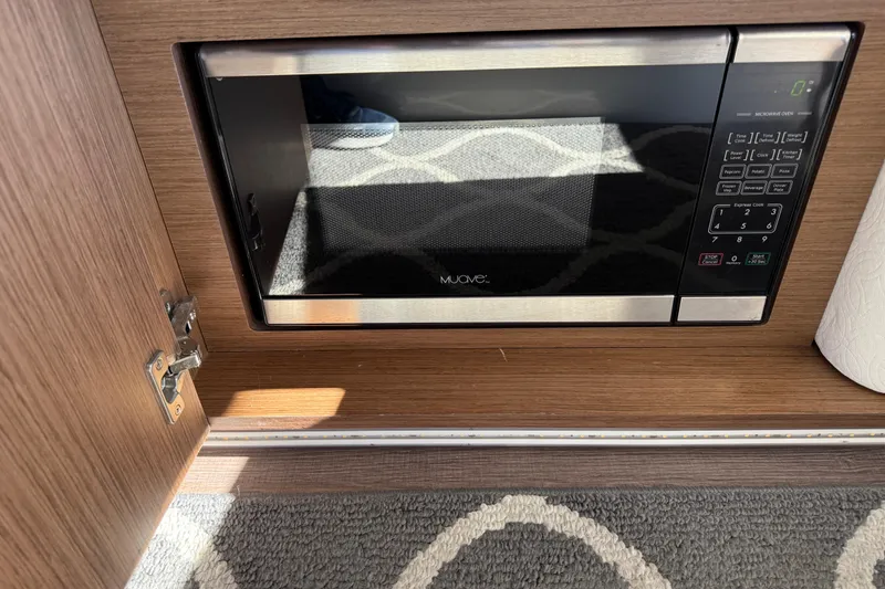 Slide: The Image of Built-in microwave in 2021 Beneteau Antares 9 boat interior. - 15