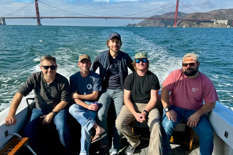 Slide: The Image of Group of five men on a 1999 Mainship Pilot 30 boat near Golden Gate Bridge. - 9