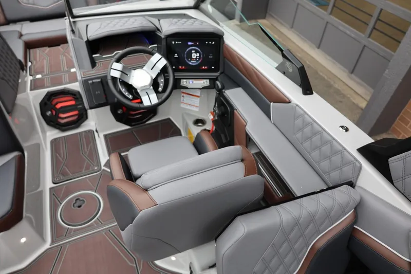 Slide: The Image of 2026 Tigé 22RZX boat interior with modern dashboard and luxurious seating. - 17