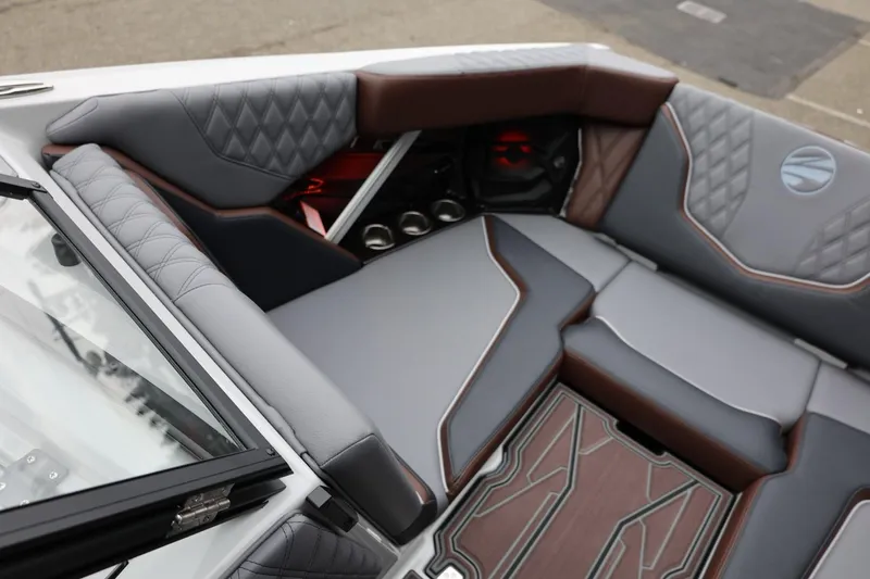 Slide: The Image of Luxurious interior of 2026 Tigé 22RZX boat with quilted seating and modern design. - 18