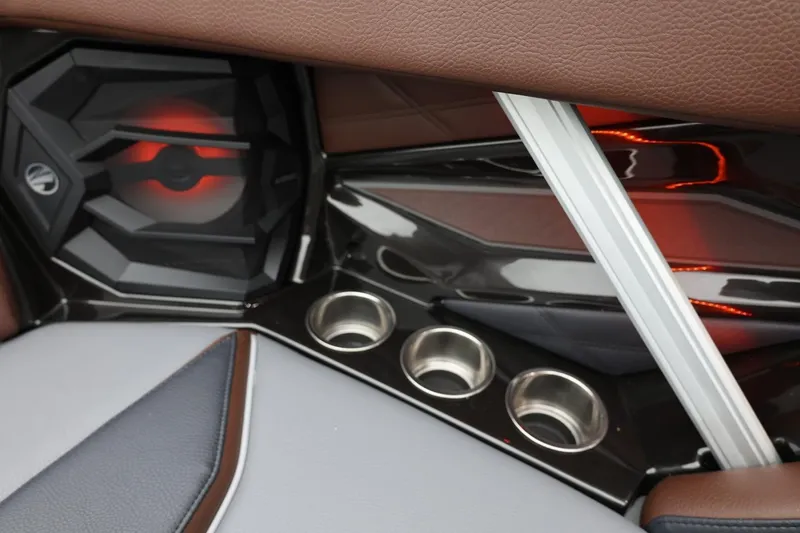 Slide: The Image of 2026 Tigé 22RZX interior with speaker, cup holders, and modern design elements. - 22