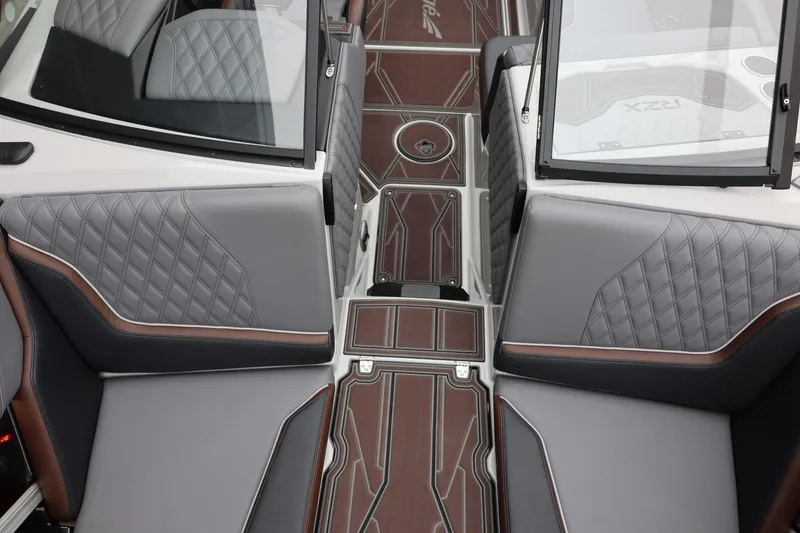 Slide: The Image of 2026 Tigé 22RZX boat interior with quilted gray seats and stylish flooring. - 23