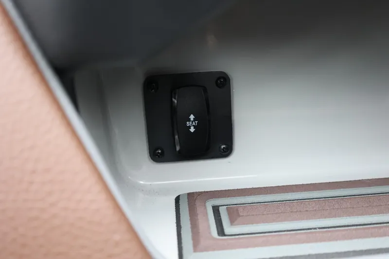 Slide: The Image of 2026 Tigé 22RZX seat adjustment switch, interior detail. - 26