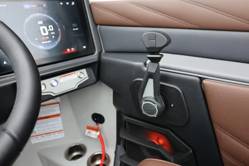 Slide: The Image of 2026 Tigé 22RZX boat interior with control panel and steering wheel. - 27