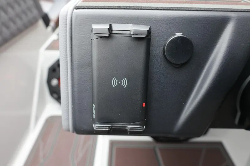 Slide: The Image of Wireless charging pad in 2026 Tigé 22RZX boat dashboard. - 28