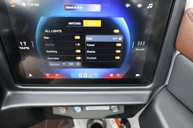Slide: The Image of Touchscreen control panel of 2026 Tigé 22RZX boat, displaying light and ballast settings. - 30