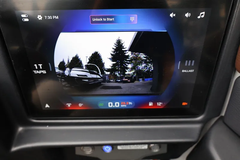 Slide: The Image of Touchscreen display in a 2026 Tigé 22RZX showing rearview camera and control options. - 35