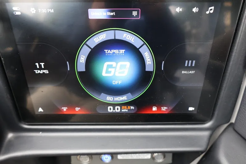 Slide: The Image of Touchscreen display of a 2026 Tigé 22RZX boat showing TAPS 3T surf system controls. - 36