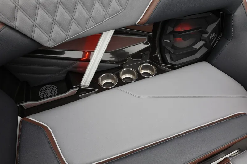 Slide: The Image of 2026 Tigé 22RZX interior with premium seating, cup holders, and integrated speaker system. - 41