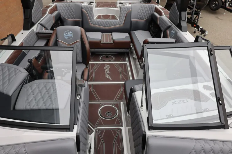 Slide: The Image of Interior of 2026 Tigé 22RZX boat with luxurious seating and modern design. - 59