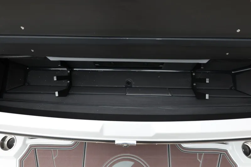 Slide: The Image of 2026 Tigé 22RZX boat storage compartment, open and empty, showcasing interior space. - 60