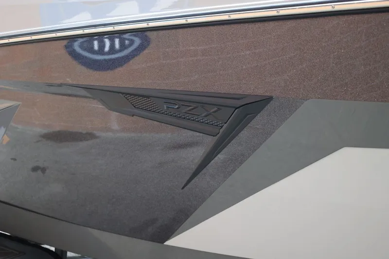 Slide: The Image of 2026 Tigé 22RZX boat side view with sleek design and RZX logo detail. - 8