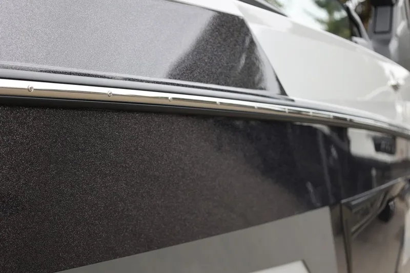 Slide: The Image of Close-up of 2026 Tigé 22RZX boat exterior with sleek, modern design. - 9