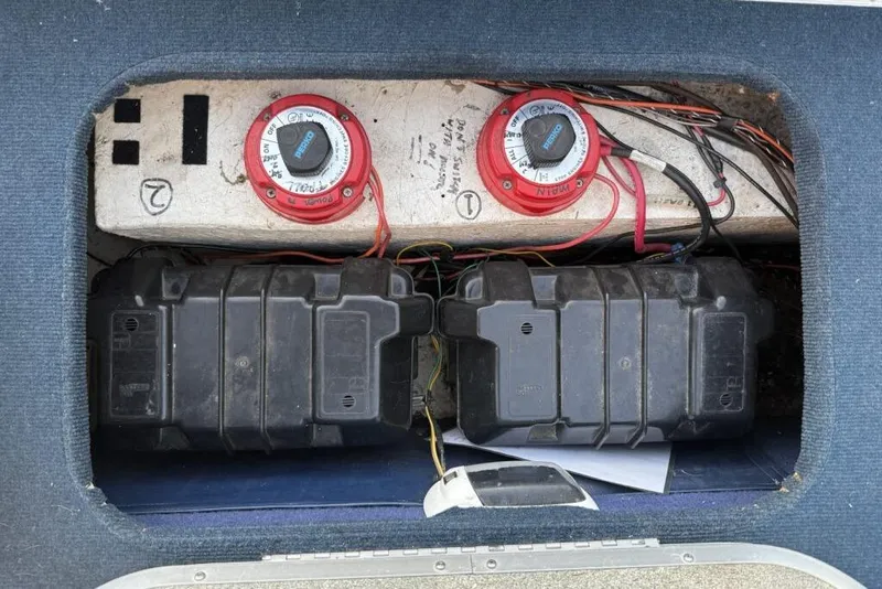 Slide: The Image of Battery compartment of a 1989 Bayliner 1800 Cobra boat with dual battery switches. - 16