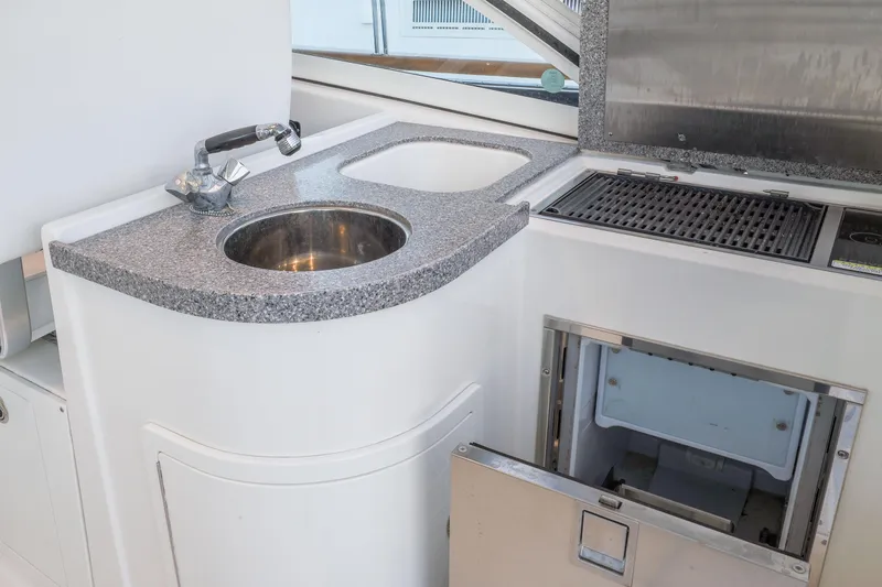 Slide: The Image of Sink, grill, and refrigerator - 17