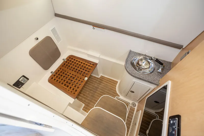 Slide: The Image of Spacious private head and shower with all amenities, with shower seat folded down - 23