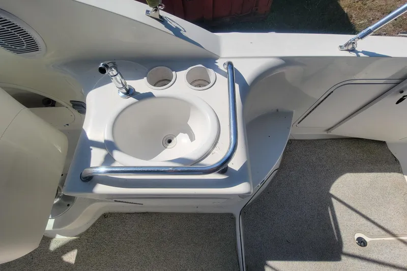 Slide: The Image of Cockpit sink area on a 2000 Sea Ray 260 Sundancer boat. - 25
