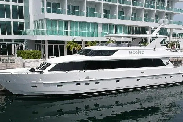 The Image of 2006 Hargrave Raised Pilothouse yacht docked near modern waterfront building. - 0