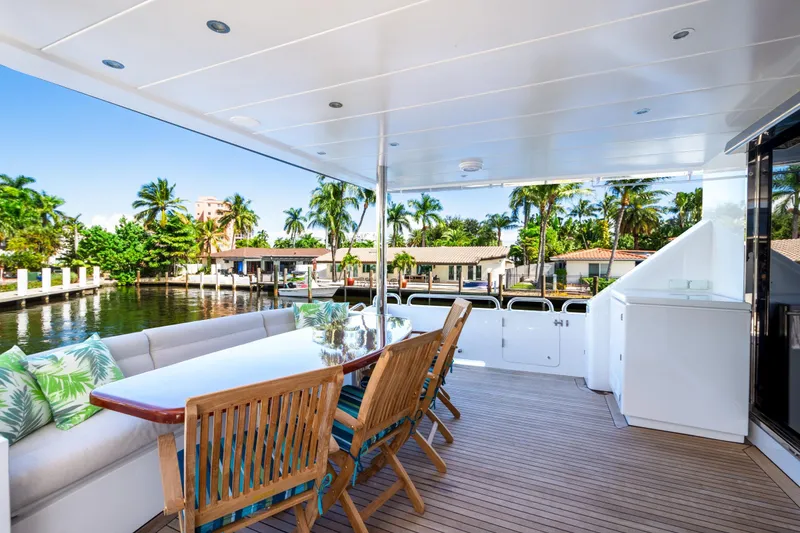 Slide: The Image of Luxurious 2006 Hargrave Raised Pilothouse yacht deck with elegant seating and waterfront view. - 10