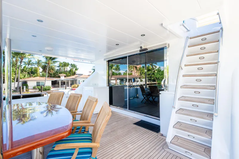 Slide: The Image of Luxurious 2006 Hargrave Raised Pilothouse yacht deck with seating and staircase. - 11