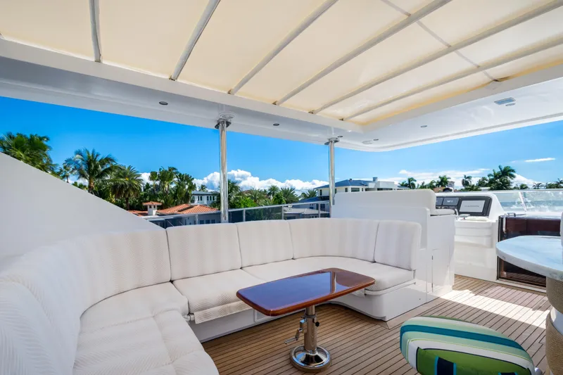 Slide: The Image of Luxurious 2006 Hargrave Raised Pilothouse yacht with elegant outdoor seating and tropical views. - 12