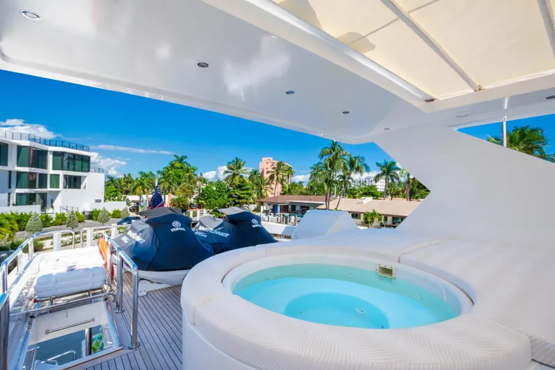Slide: The Image of Luxurious 2006 Hargrave Raised Pilothouse yacht deck with jacuzzi and jet skis. - 13