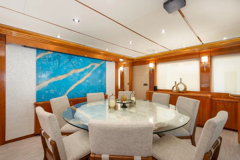 Slide: The Image of Luxurious dining area on 2006 Hargrave Raised Pilothouse yacht with elegant decor and round table. - 23