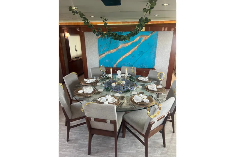 Slide: The Image of Luxurious dining area on 2006 Hargrave Raised Pilothouse yacht with elegant table setting. - 27