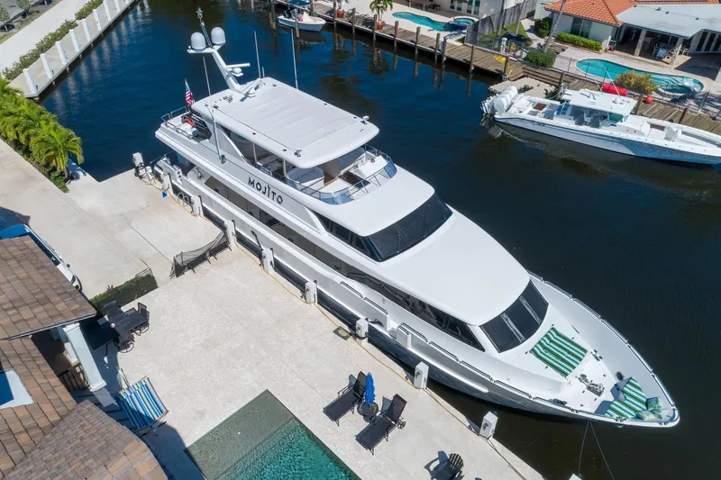 Slide: The Image of Luxury 2006 Hargrave Raised Pilothouse yacht docked in a sunny marina. - 3