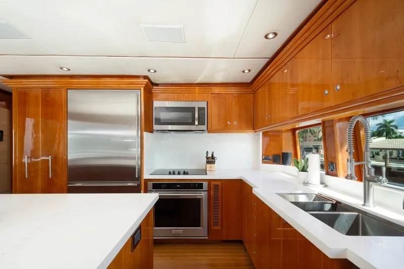 Slide: The Image of Luxurious 2006 Hargrave Raised Pilothouse yacht kitchen with modern appliances and sleek wood cabinetry. - 31