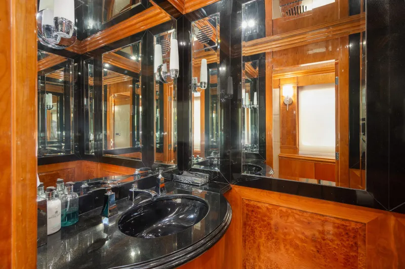 Slide: The Image of Luxurious bathroom with wood paneling and black countertop in 2006 Hargrave Raised Pilothouse yacht. - 33