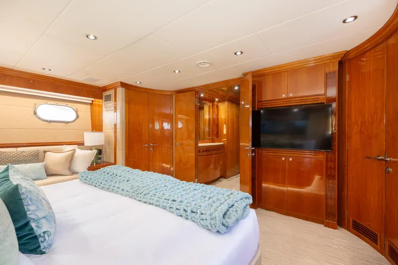 Slide: The Image of Luxurious 2006 Hargrave Raised Pilothouse yacht bedroom with elegant wood finishes and modern amenities. - 36