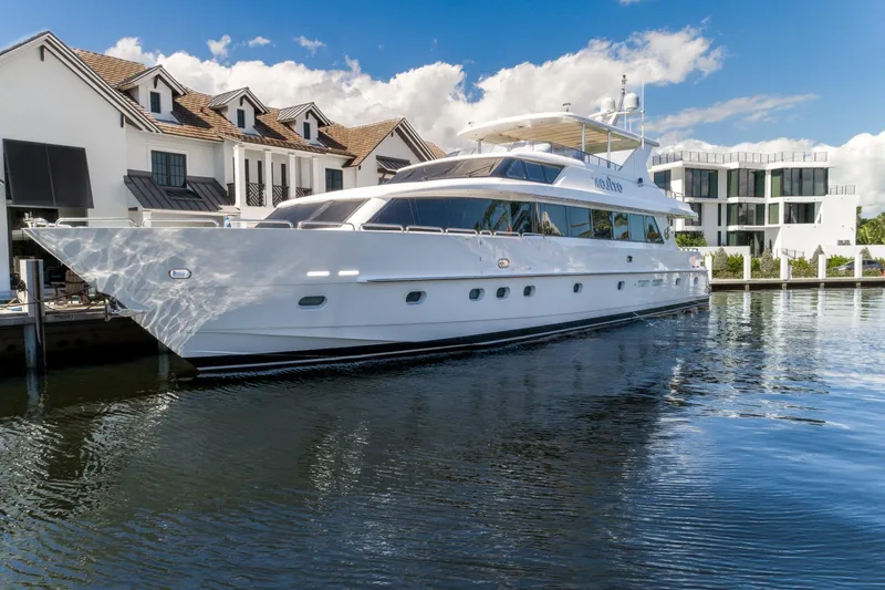 Slide: The Image of Luxury 2006 Hargrave Raised Pilothouse yacht docked by waterfront homes. - 4