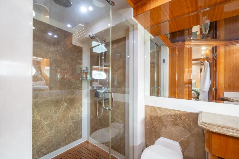 Slide: The Image of Luxurious bathroom in 2006 Hargrave Raised Pilothouse yacht with marble shower and wooden accents. - 40
