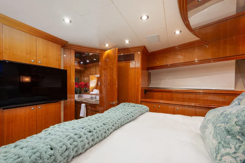 Slide: The Image of Luxurious 2006 Hargrave Raised Pilothouse yacht bedroom with elegant wood paneling and modern amenities. - 42