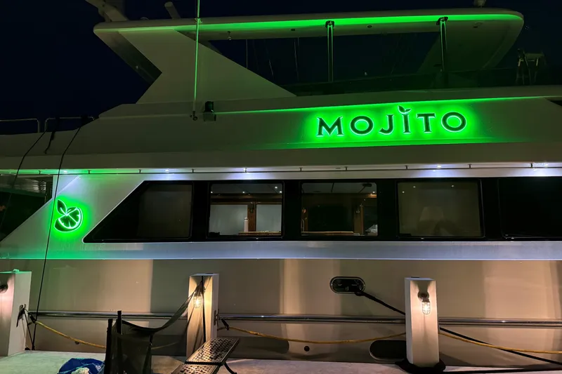 Slide: The Image of 2006 Hargrave Raised Pilothouse yacht "Mojito" with vibrant green lighting at night. - 5