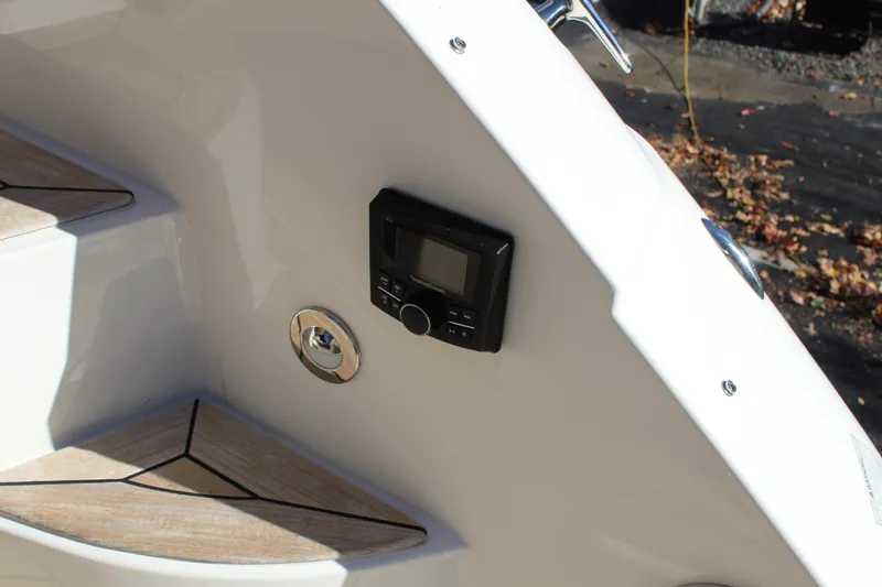 Slide: The Image of 2017 Sea Ray Sundancer 350 Coupe interior with control panel and wooden steps. - 13