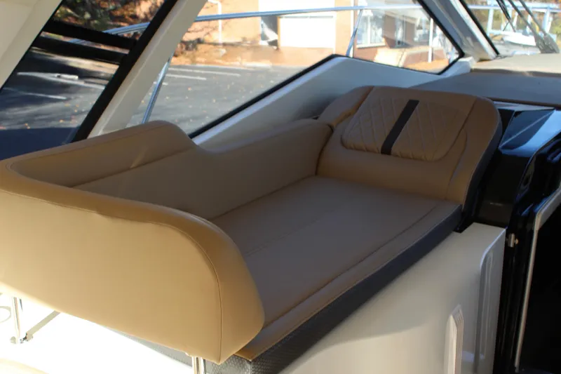 Slide: The Image of Luxurious seating on 2017 Sea Ray Sundancer 350 Coupe yacht, featuring tan upholstery. - 19