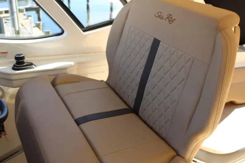 Slide: The Image of Luxurious seating in 2017 Sea Ray Sundancer 350 Coupe with elegant stitching and branding. - 21