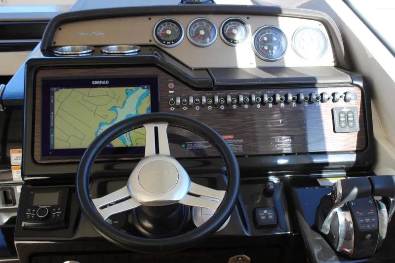 Slide: The Image of 2017 Sea Ray Sundancer 350 Coupe dashboard with navigation system and controls. - 23