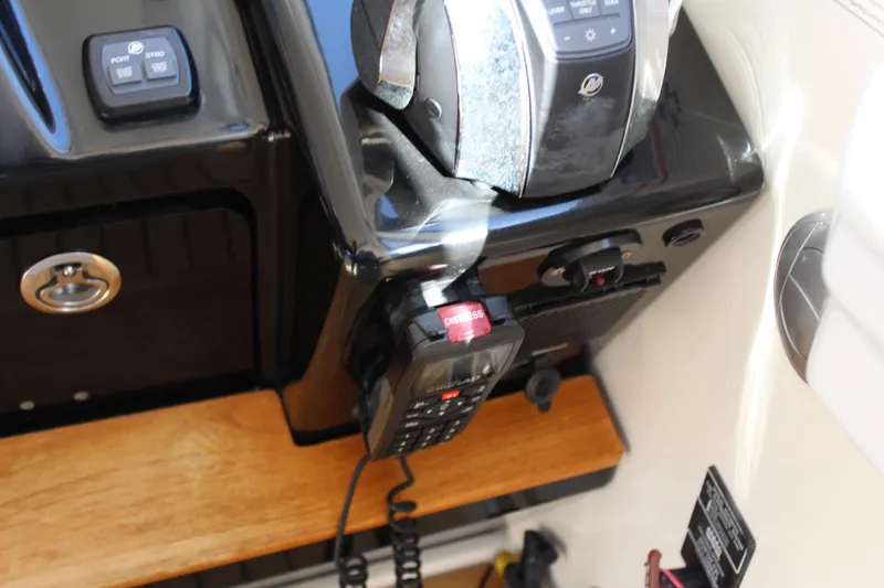 Slide: The Image of Control panel of 2017 Sea Ray Sundancer 350 Coupe with radio and throttle. - 28