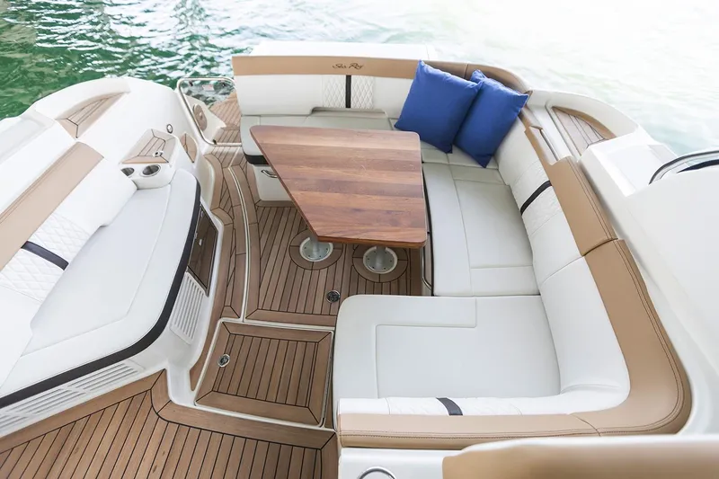 Slide: The Image of 2017 Sea Ray Sundancer 350 Coupe yacht with sleek design, docked outdoors. - 3