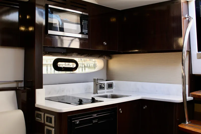 Slide: The Image of Luxurious kitchen interior of 2017 Sea Ray Sundancer 350 Coupe yacht. - 30